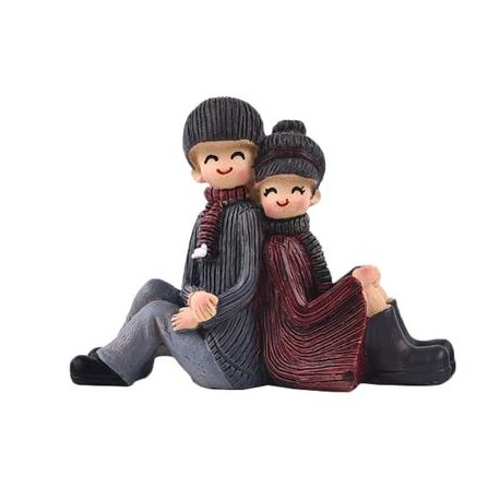 FIGURA PAREJA SENTADA DE ESPALDAS